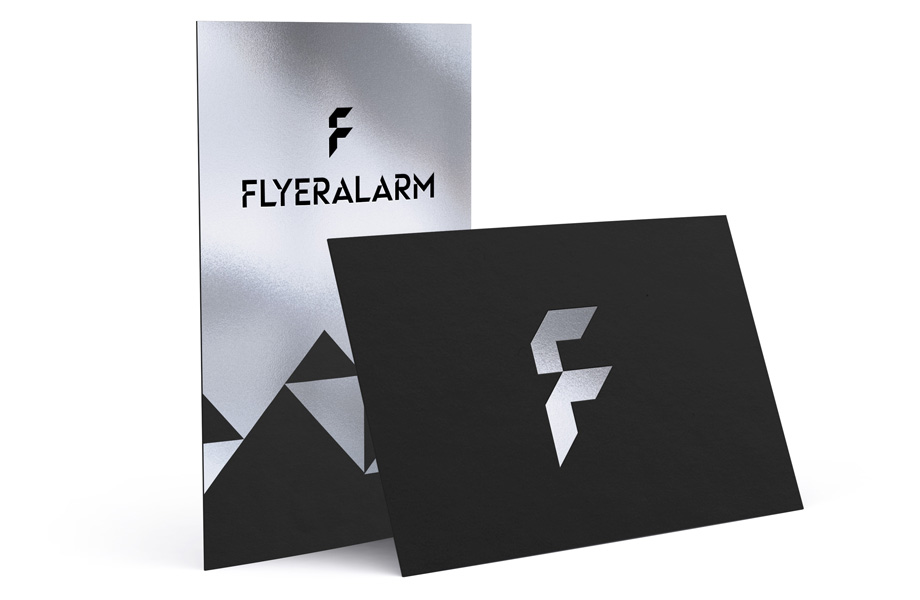 Business cards made from black card with silver hot foil finish